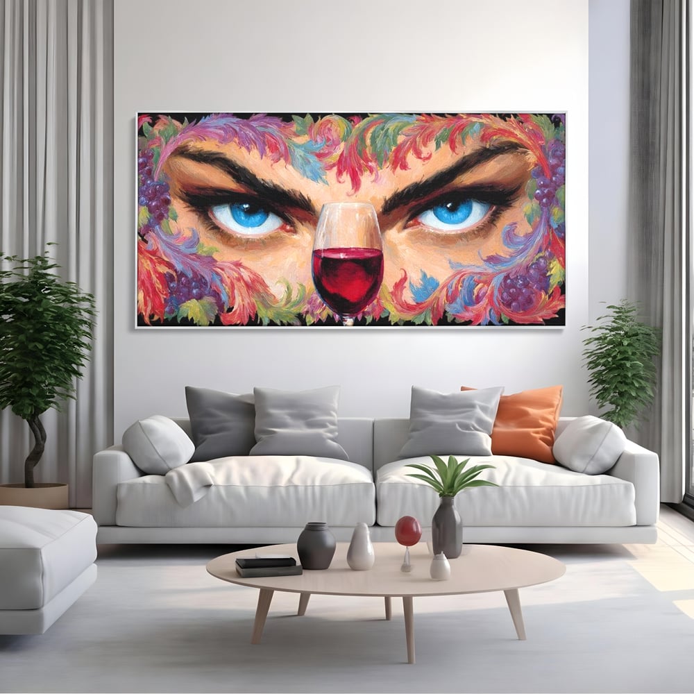 Tablou canvas cu tablou canvas cu ochi albastri si pahar de vin, in rama de aluminiu argintiu, pe perete intr-un living